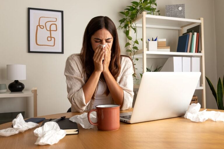home allergy relief woman working sneezing