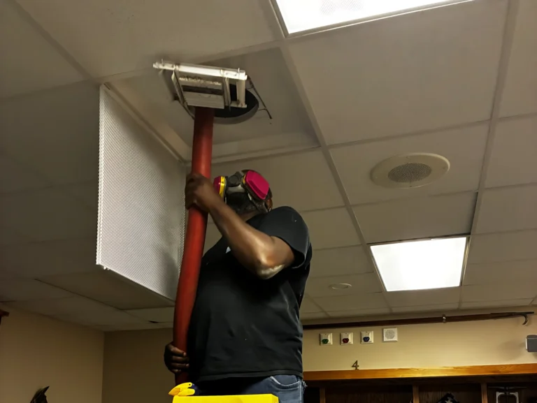 commercial air vent cleaning Pro shine worker using vacuum
