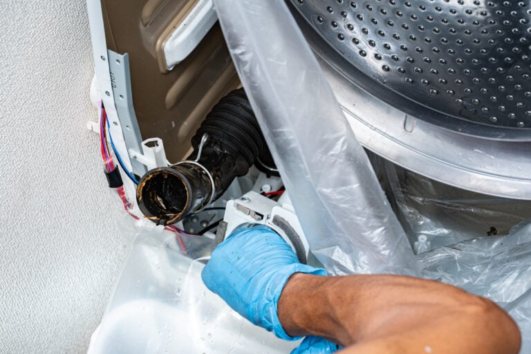clogged dryer vent hand opening washing machine