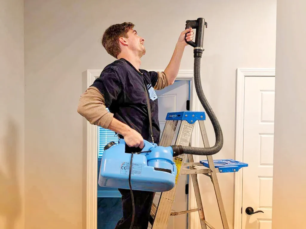 professional disinfection services Pro Shine young man using desinfecting machine