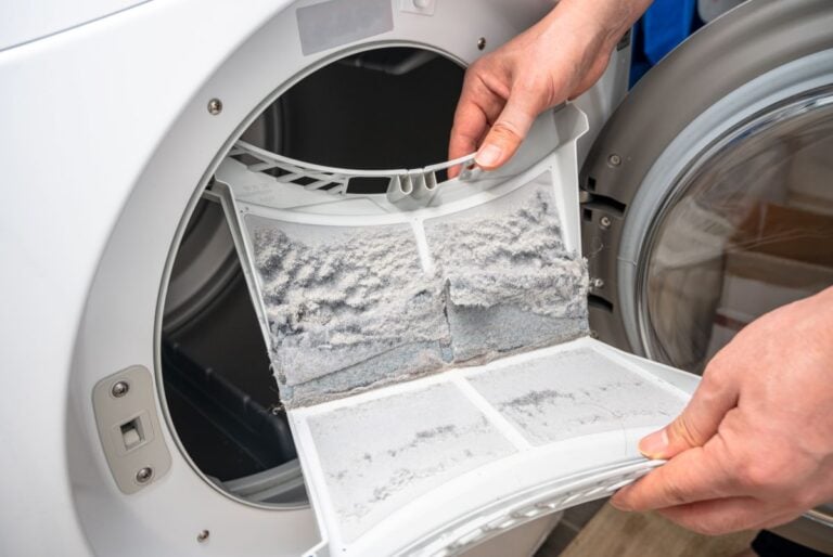how to clean dryer vent without moving dryer hand holding dirty lint