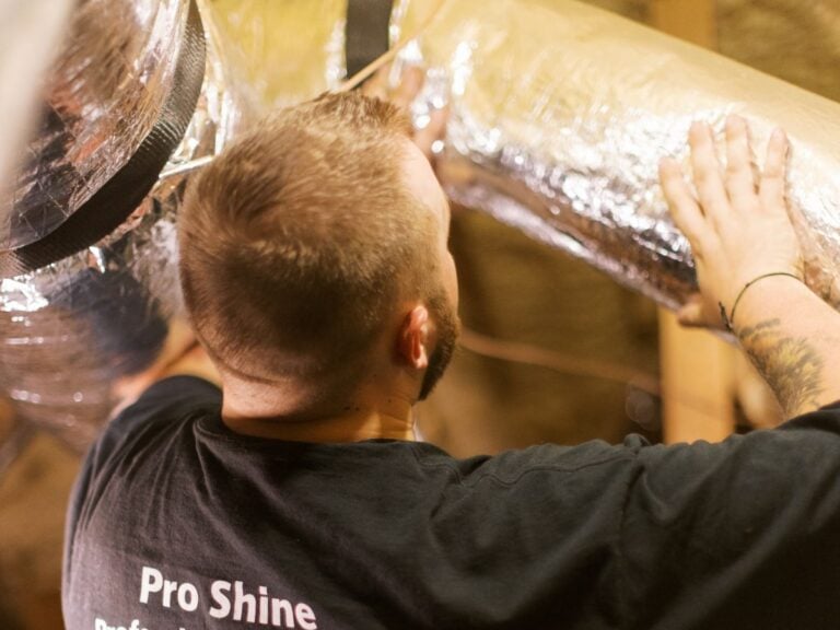 duct wrap installation guy repairing ducts
