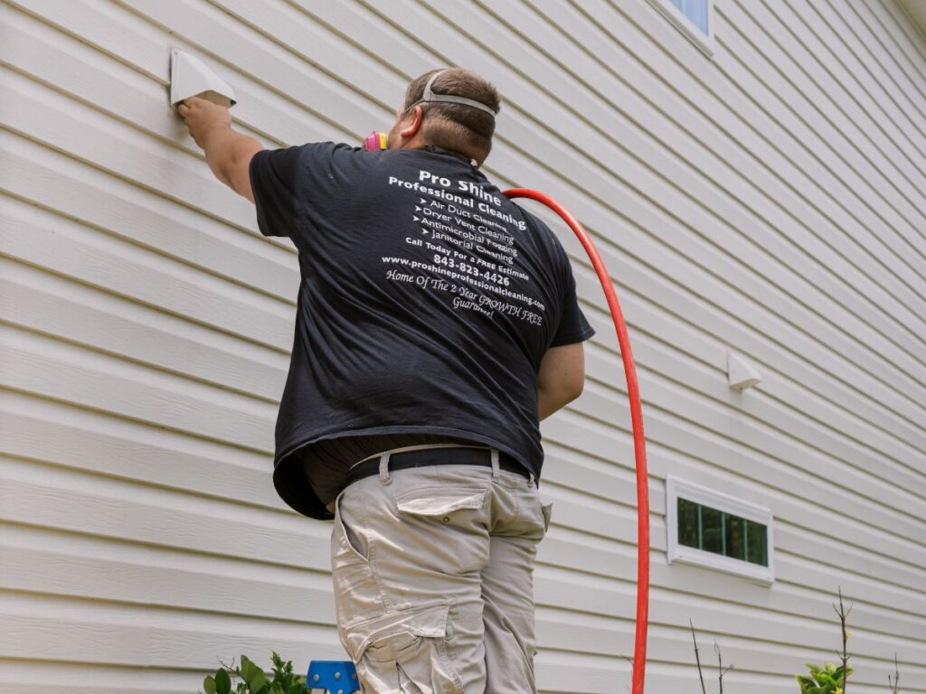 how to clean dryer vent without moving dryer worker cleaning outside vent