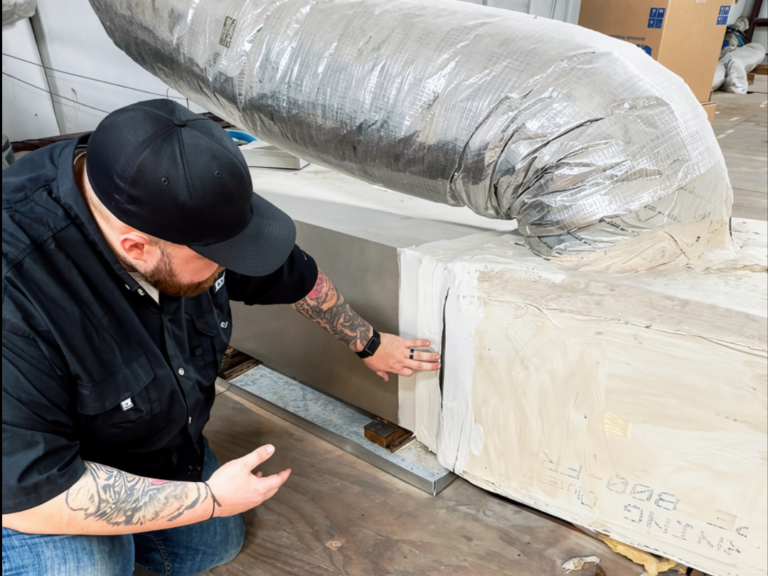 air duct cleaning business pro shine worker looking into duct