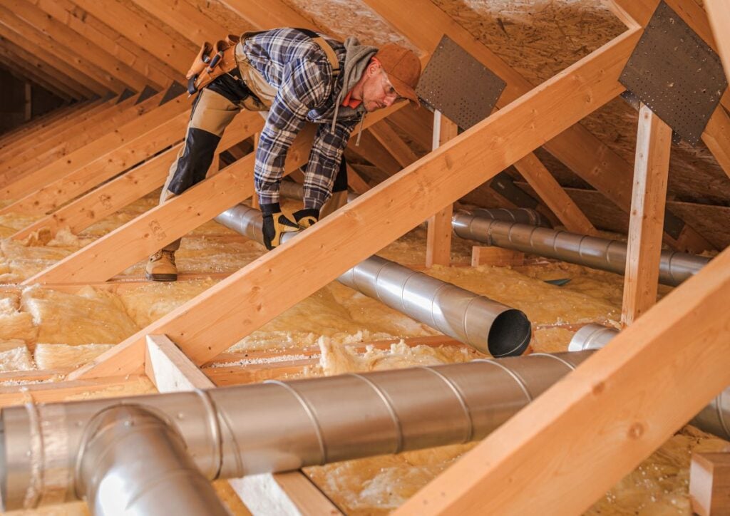 guy installing air duct